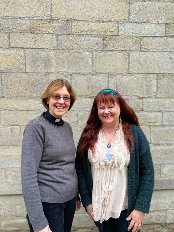 Ellen McKessock and Canon Lynda Barley standing outside the old cathedral school