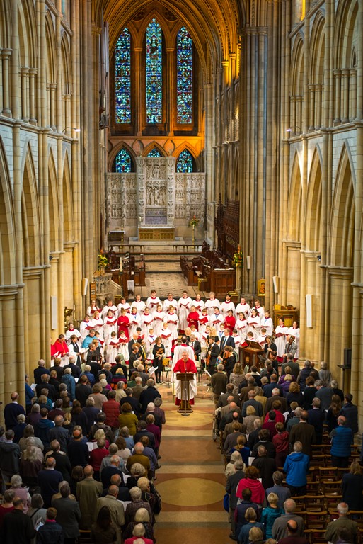 Ariel view of the nave with choir and orchestra and congregation at Truro Cathedral