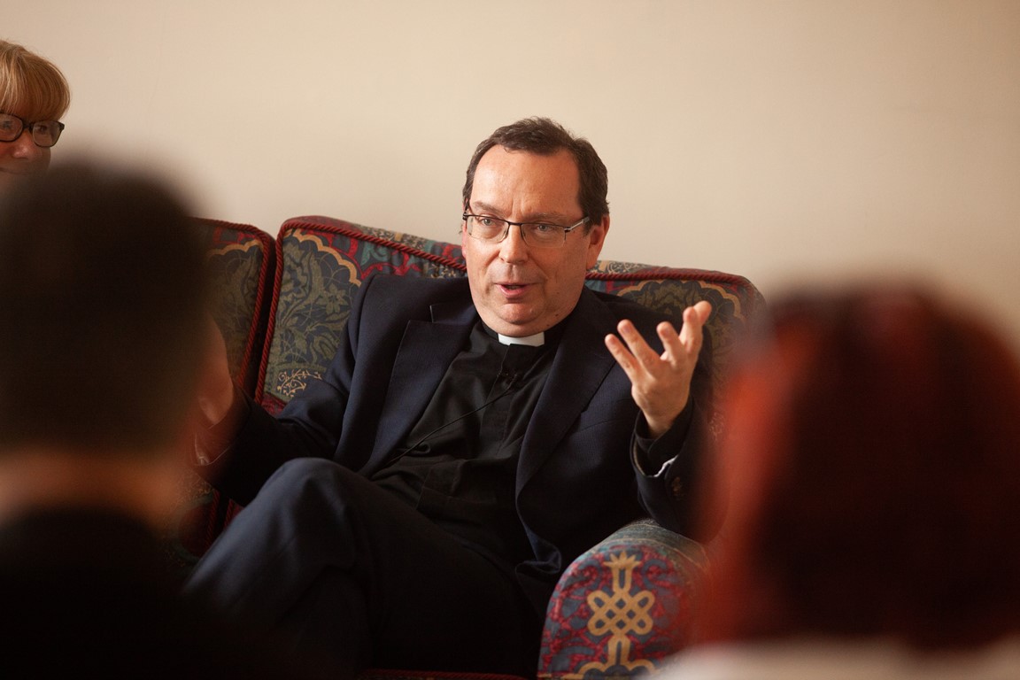 Bishop of Truro sitting in a chair