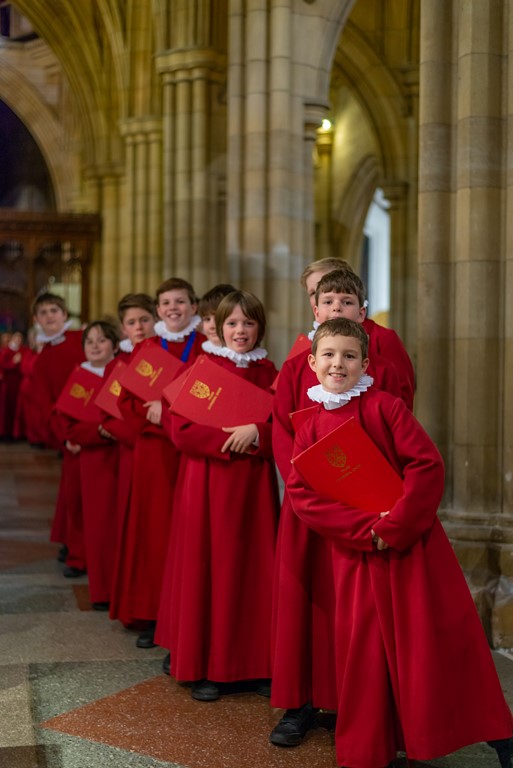 Truro Cathedral choristers standing inside the cathedral.