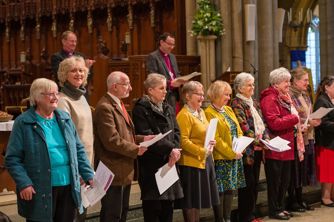 Newly accredited Lay Pastoral Ministers standing in Truro Cathedral