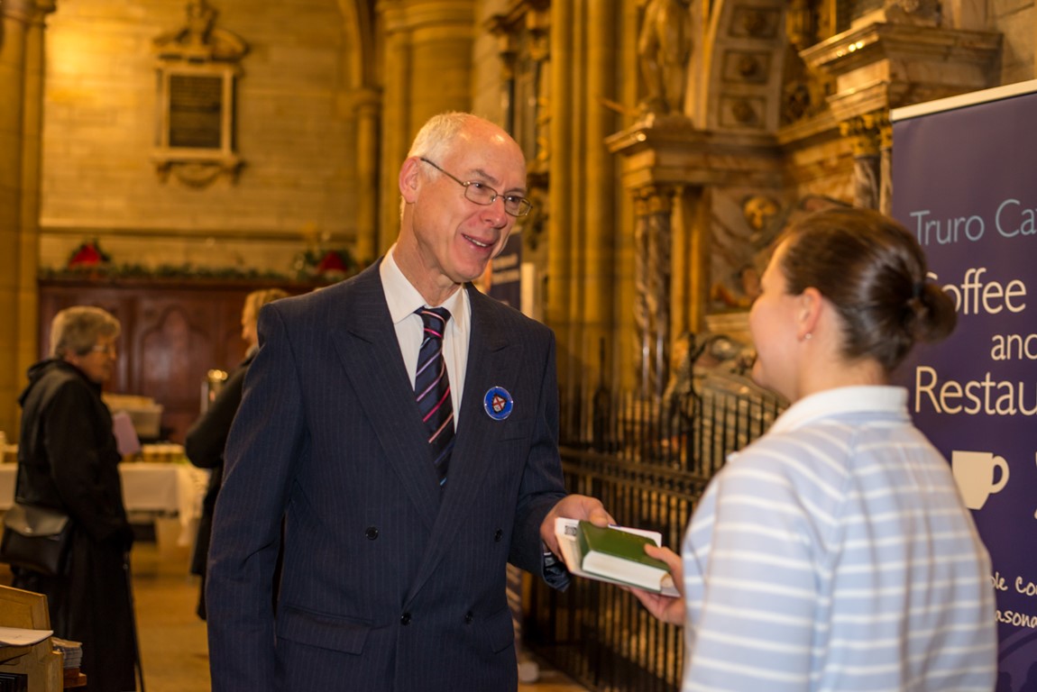 Truro Cathedral Steward greeting a member of the public