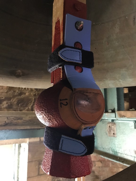 Close up of a Truro Cathedral Bell Clapper fitted with a leather muffle